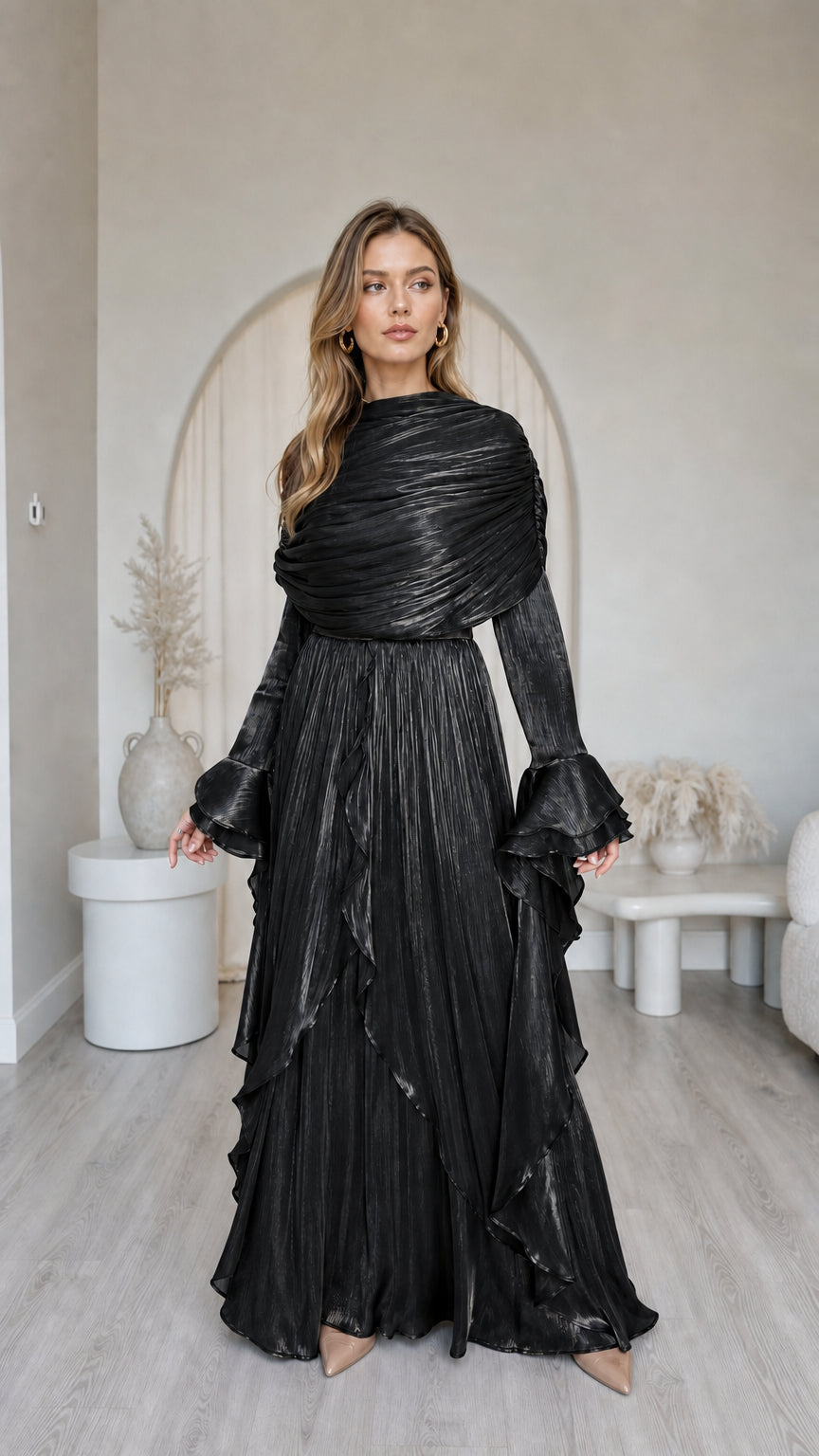 Front view of model wearing metallic black pleated long sleeve maxi dress