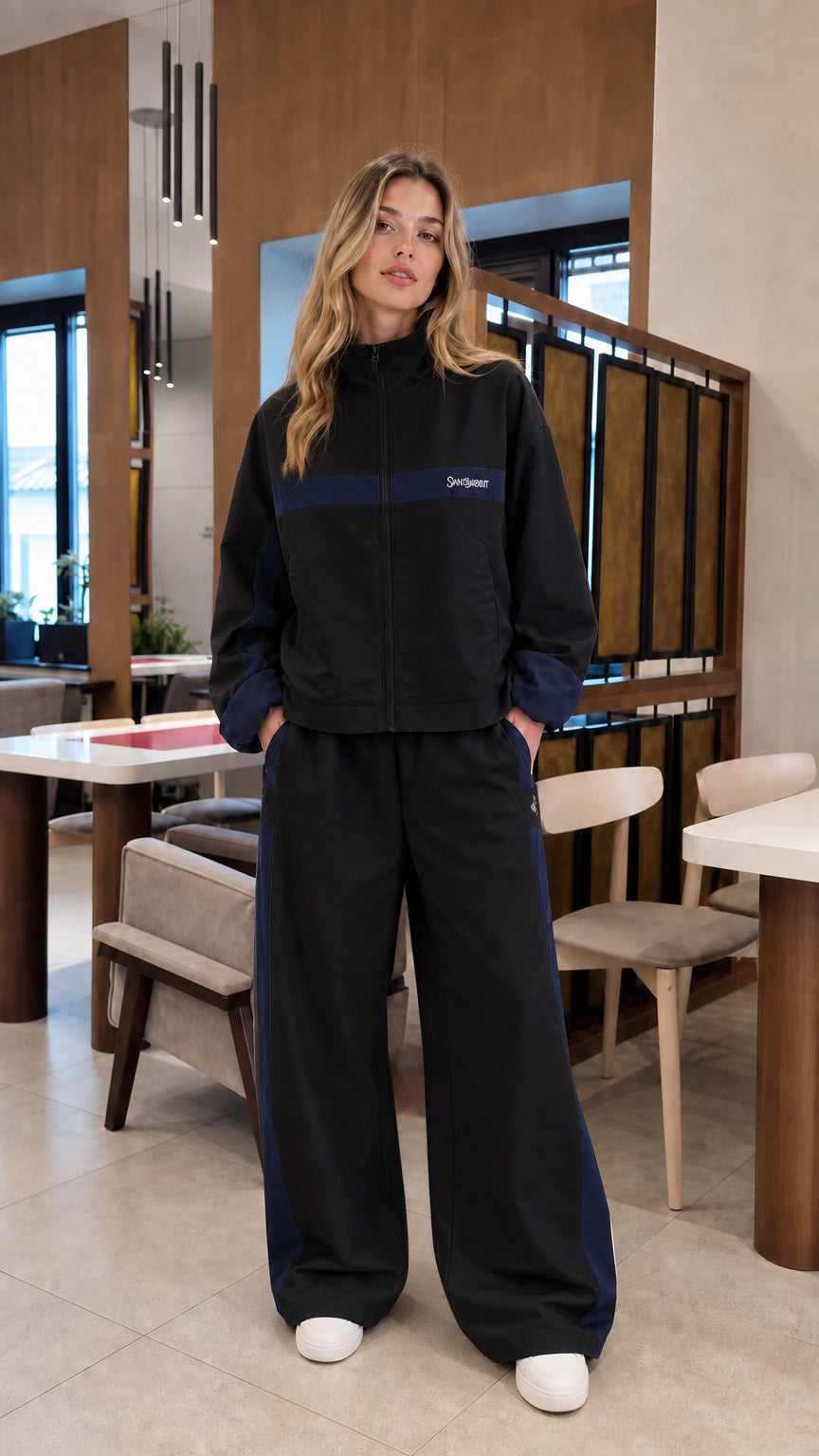 Black colorblock zip-up jacket and wide-leg tracksuit set on model