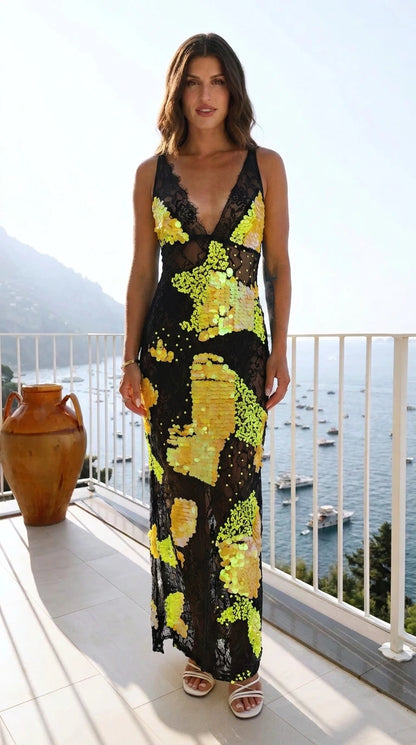 Front view of model wearing black sequin lace maxi dress