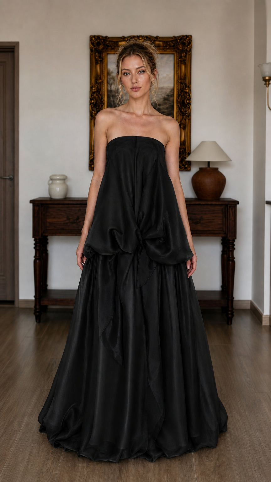 Model wearing black strapless tiered maxi dress