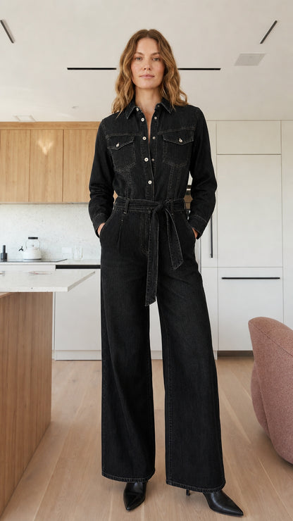 Model wearing black denim jumpsuit