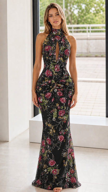 Front view of black floral embroidered halter evening dress
