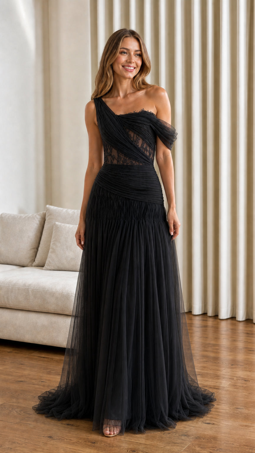 Front view of black one-shoulder pleated tulle evening gown