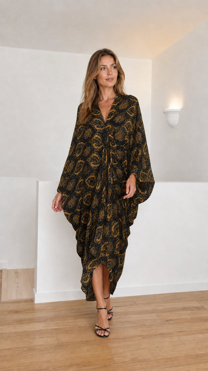 Model wearing black paisley kaftan dress