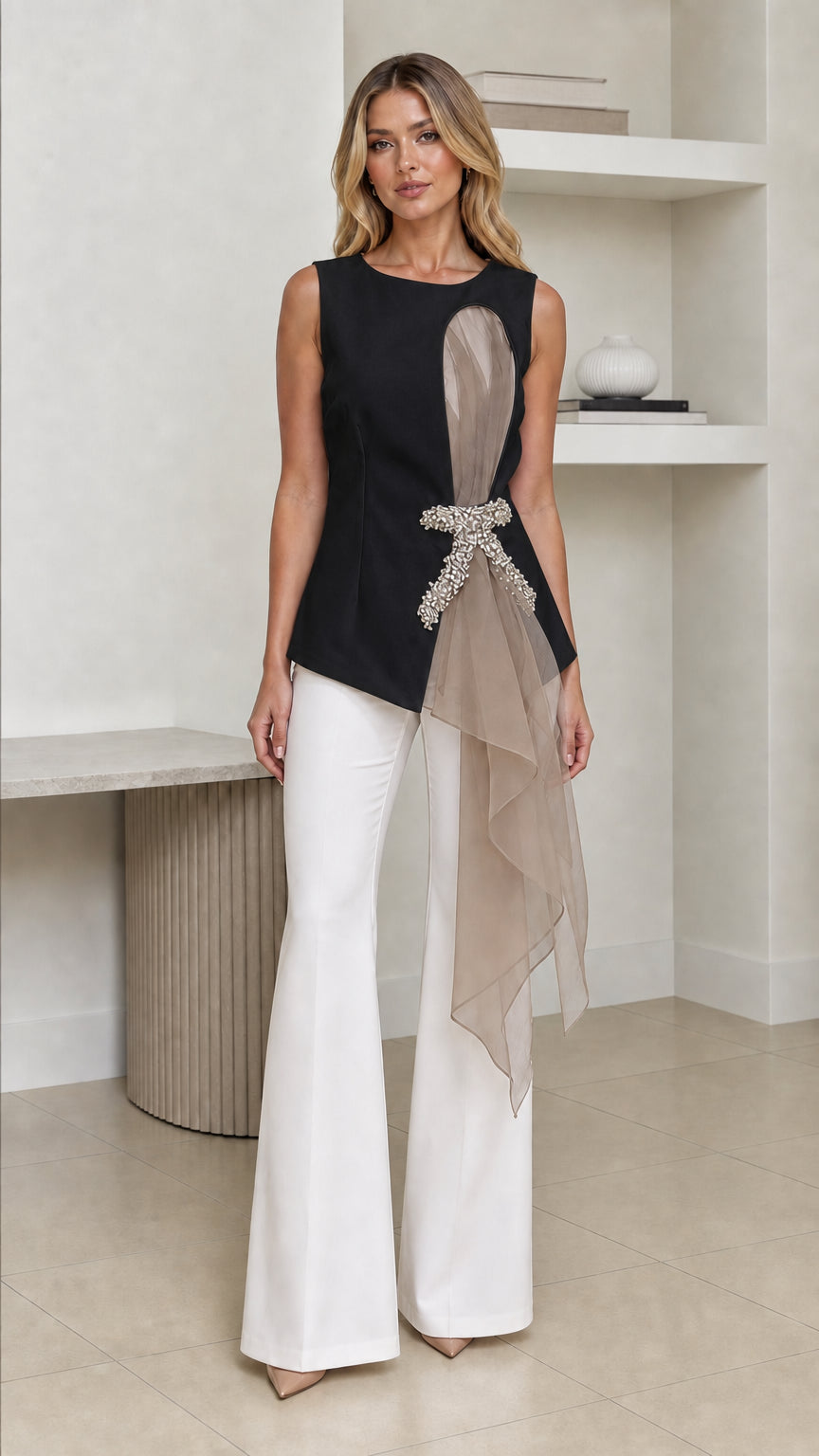 Front view of woman wearing black color variant of the asymmetric top