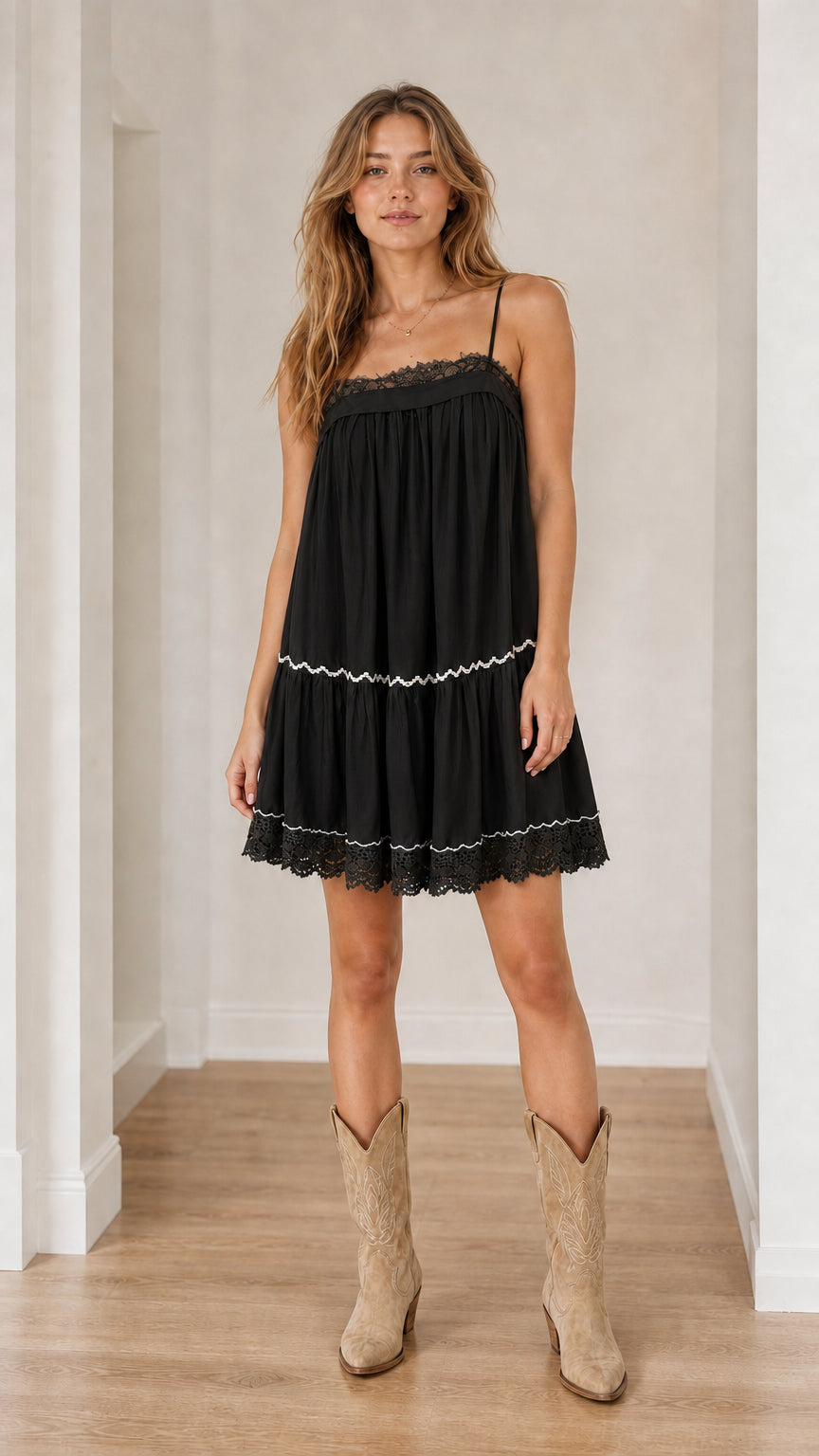 Model wearing black boho tiered camisole dress