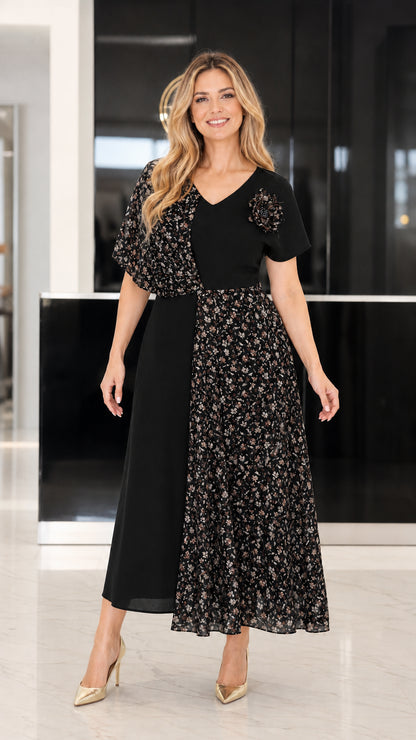Front view of black asymmetrical floral patchwork midi dress