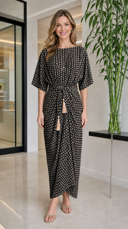 Front view of woman wearing black geometric print maxi dress