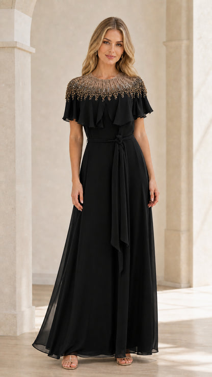 Front view of black beaded capelet maxi dress