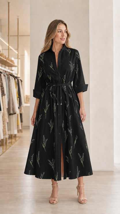 Model wearing black floral midi shirt dress