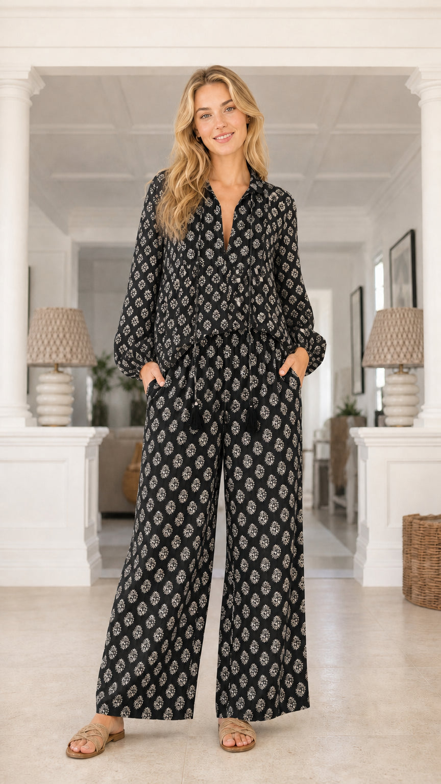Model wearing black printed two piece set