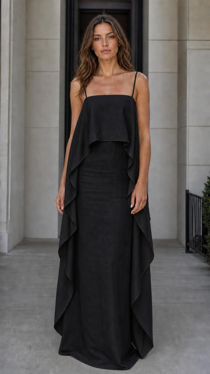 Model wearing the black color variant of the flowing overlay maxi dress