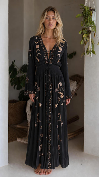 Front view of model wearing black celestial embroidered maxi dress
