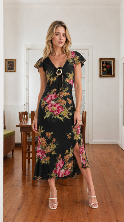 Model wearing black floral flutter sleeve midi dress