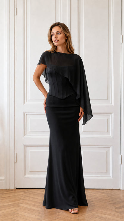 Model wearing black formal cape evening dress