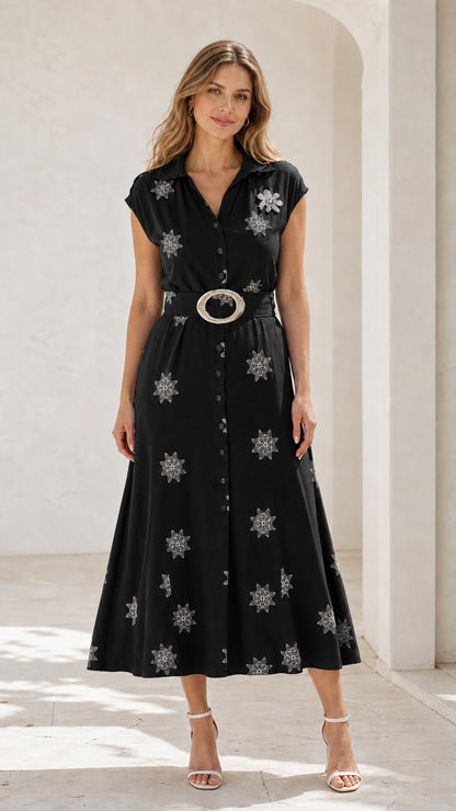 Front view of black embroidered belted midi shirt dress