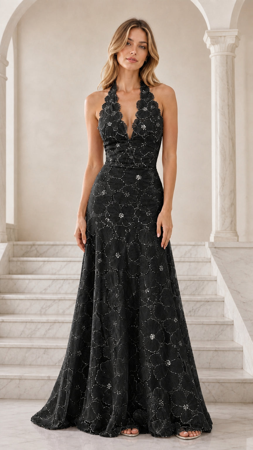 Front view of black floral embroidered halter backless evening gown