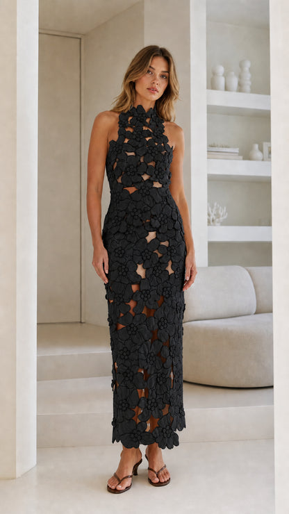 Front view of Black floral laser-cut halter midi dress