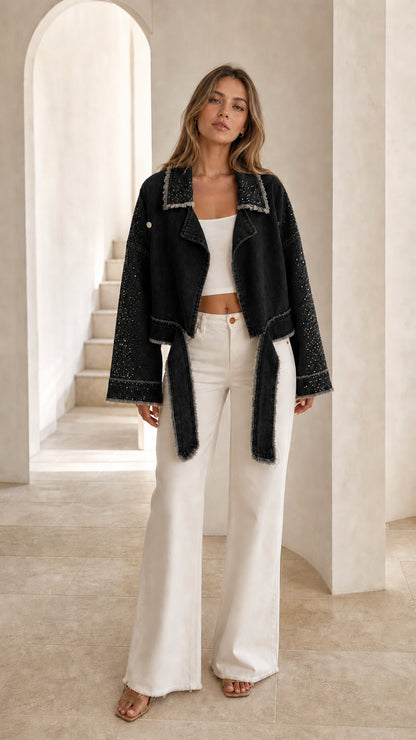 Front view of black rhinestone fringe cropped jacket with tie waist