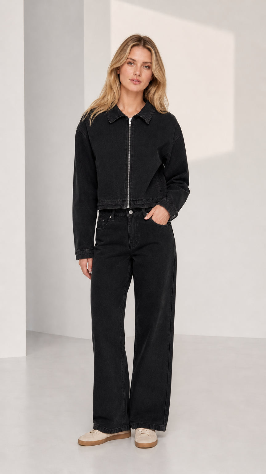 Woman wearing black denim jacket and wide-leg pants set