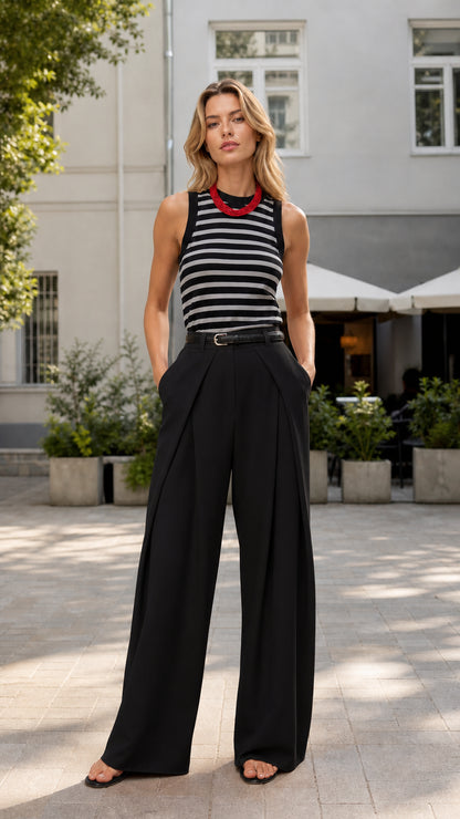 Model wearing black wide-leg trousers