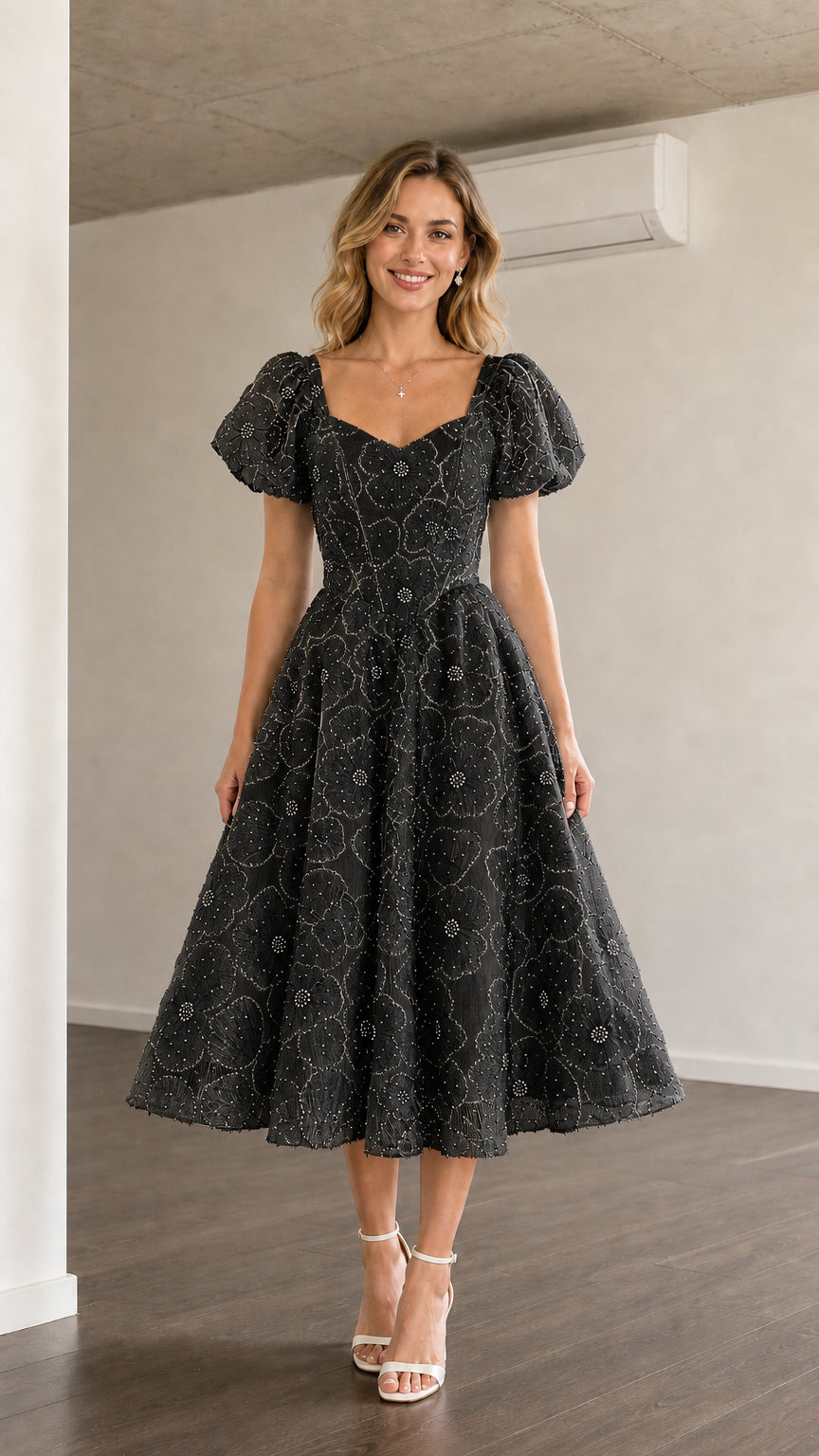 Front view of black puff sleeve midi dress