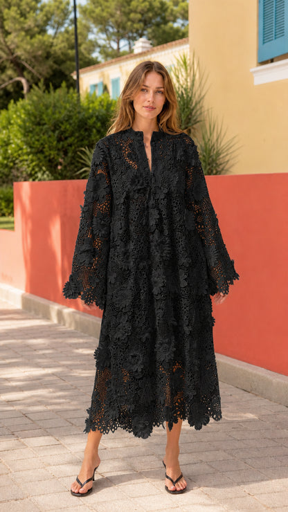 Front view of woman wearing black floral lace midi dress