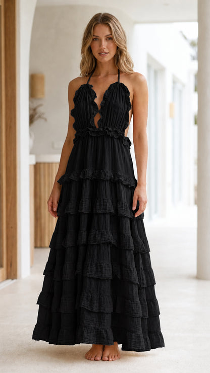 Model wearing Black Boho Ruffle Halter Backless Tiered Maxi Dress