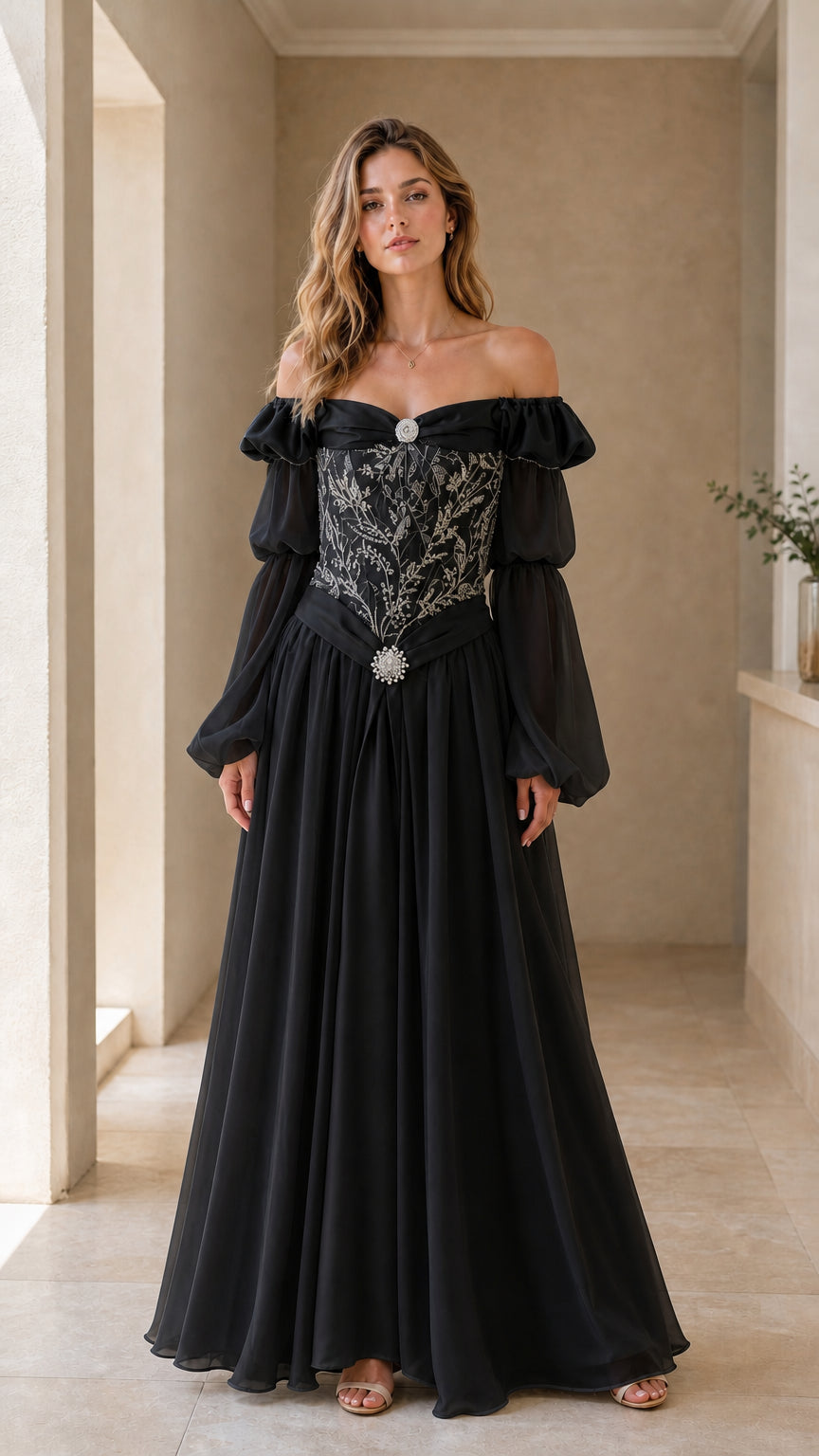 Model wearing black Renaissance maxi dress with silver embroidery and off-shoulder puff sleeves