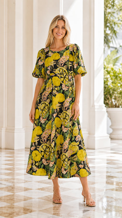 Model wearing black citrus floral print midi dress
