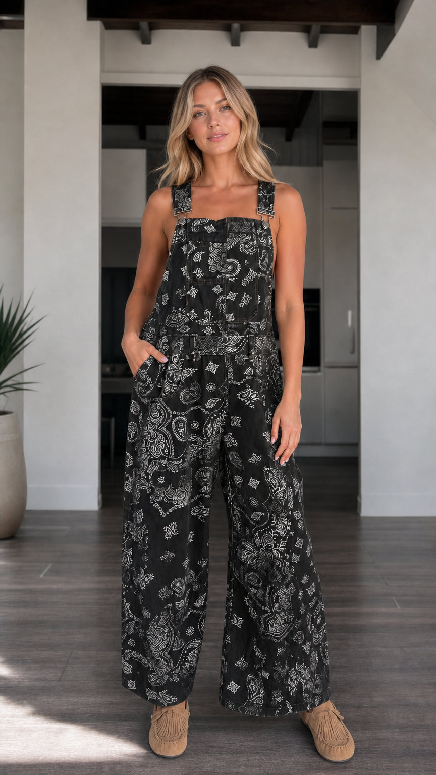 Front view of woman wearing Black paisley print wide-leg overalls