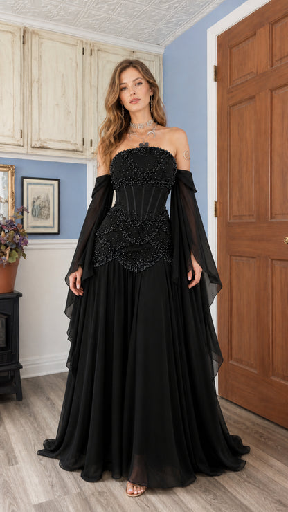 Black strapless beaded corset evening gown with draped chiffon sleeves