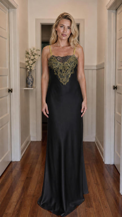 Front view of model wearing black satin maxi slip dress