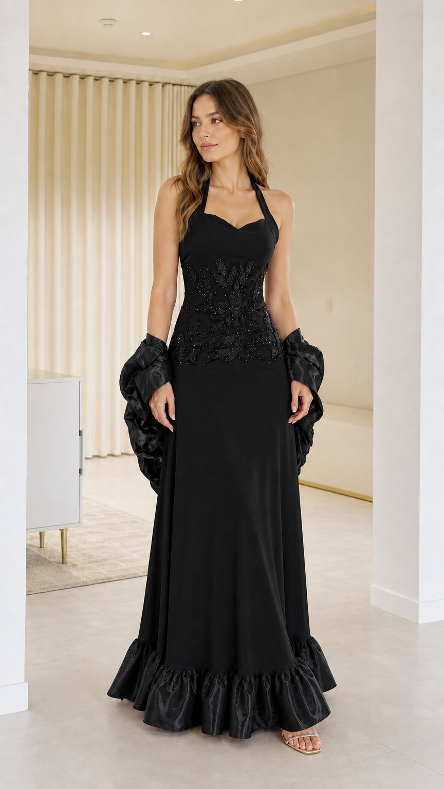 Front view of woman wearing black halter neck evening dress