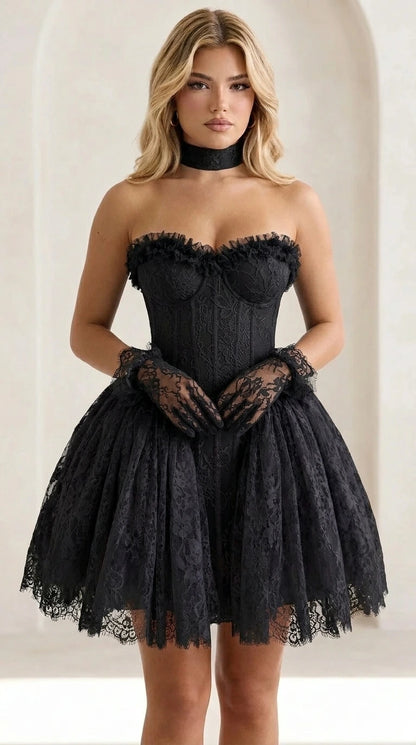 Front view of model wearing black lace corset mini dress