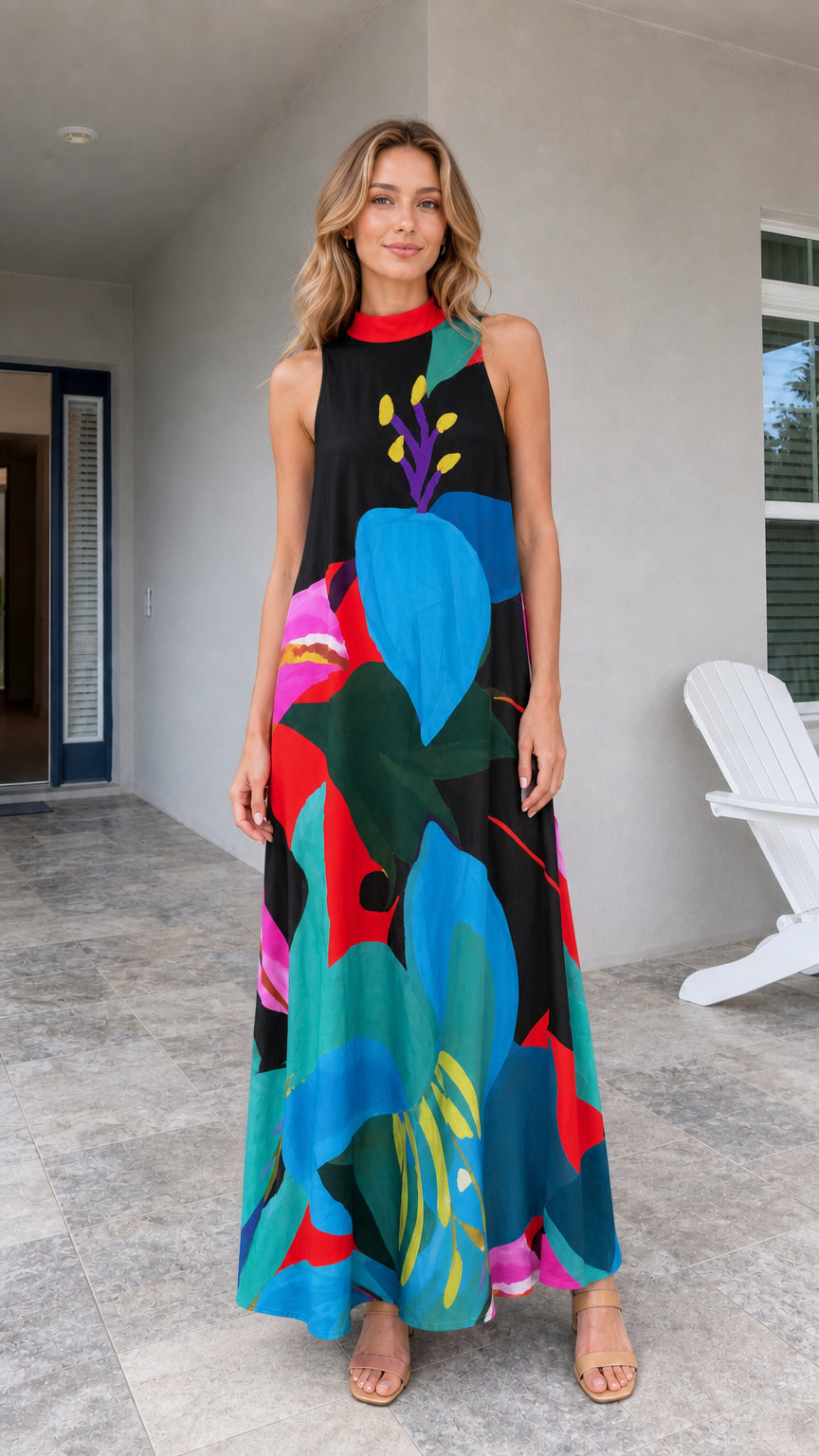 Model wearing black tropical print maxi dress
