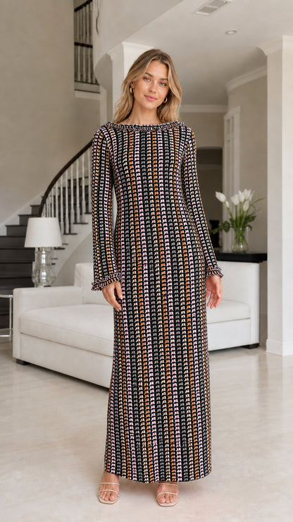 Front view of model wearing black striped crochet maxi dress