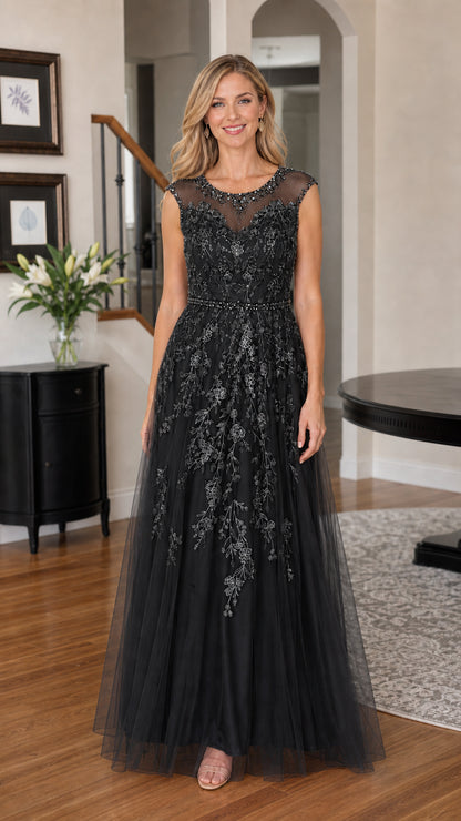 Woman wearing black embroidered tulle evening gown