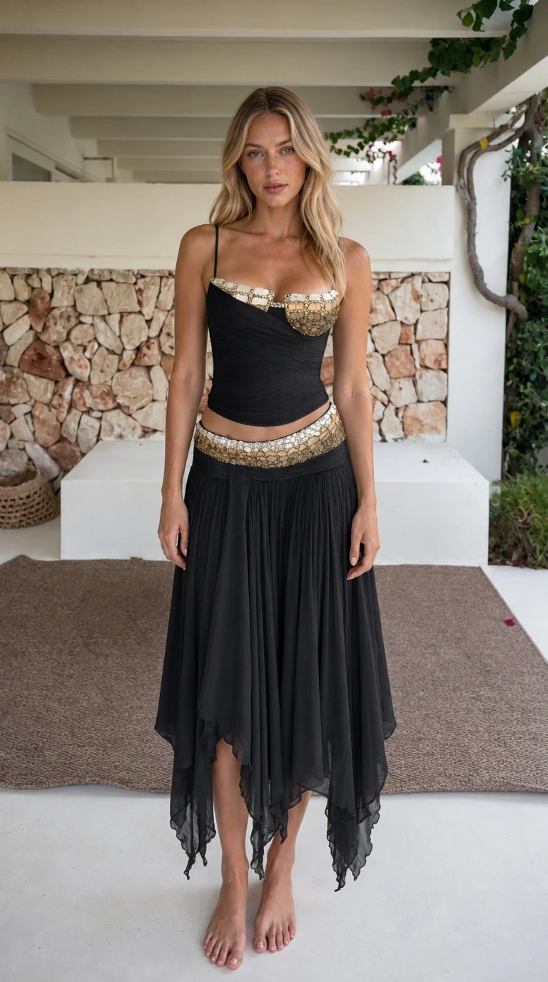 Model wearing black two-piece beaded crop top and skirt set