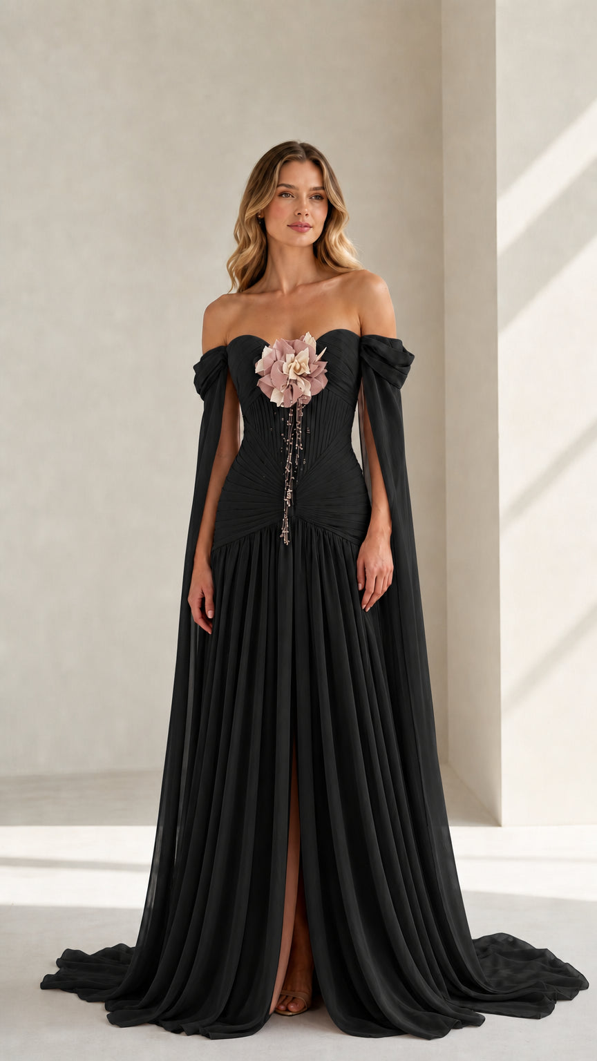 Front view of black evening gown with cape sleeves