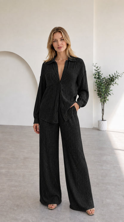 Full view of model in black textured two-piece lounge set
