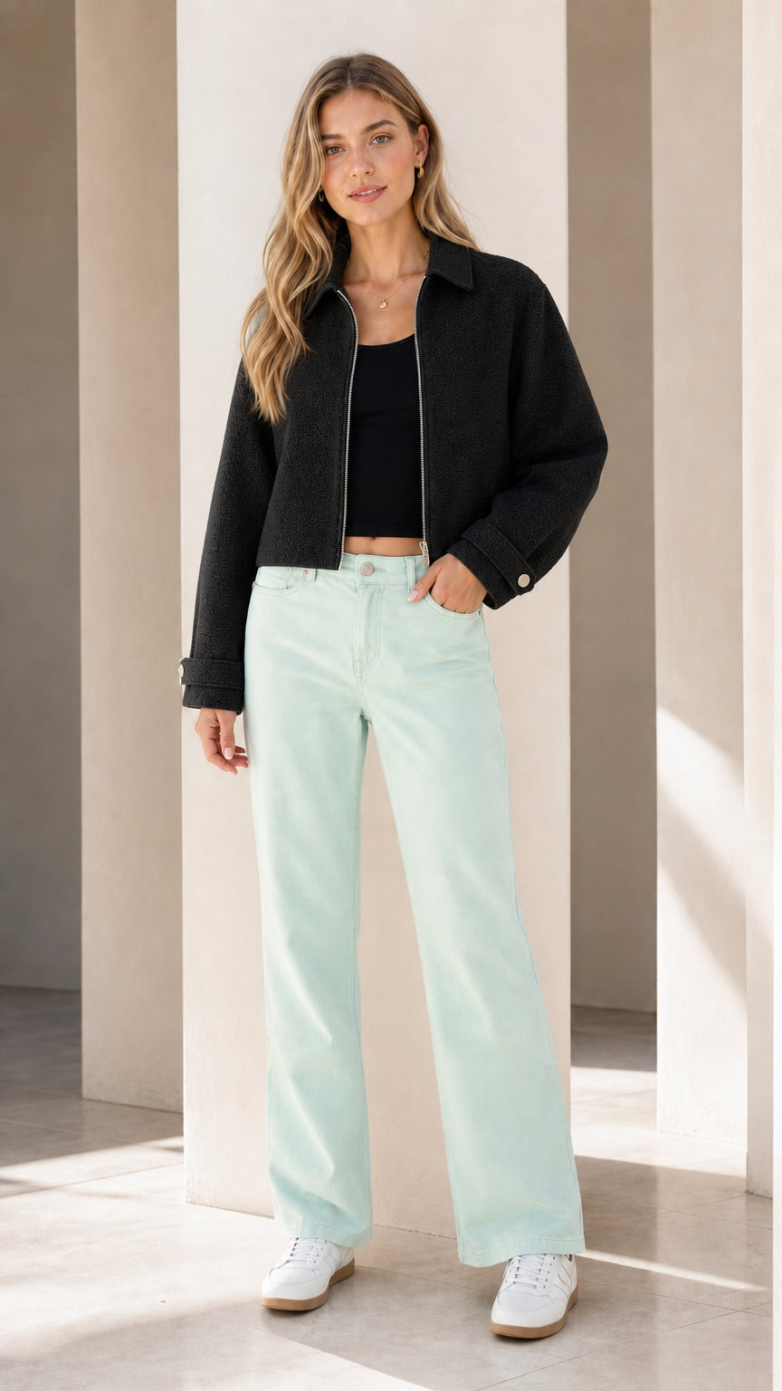 Model wearing black jacket with mint green pants