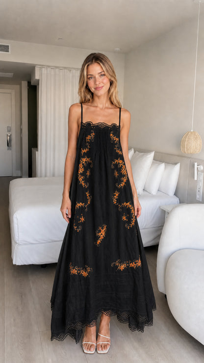 Model wearing black embroidered maxi dress