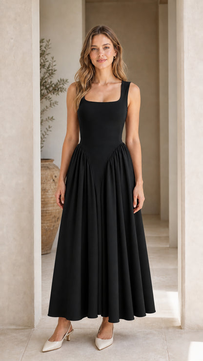 Front full view of woman wearing black maxi dress
