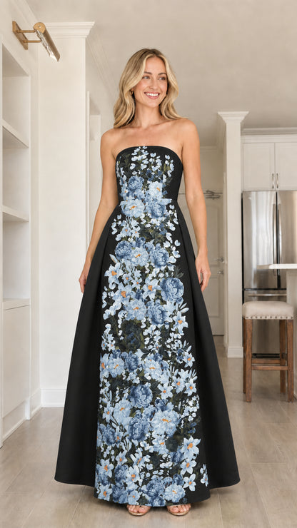 Front view of model in black floral strapless maxi dress