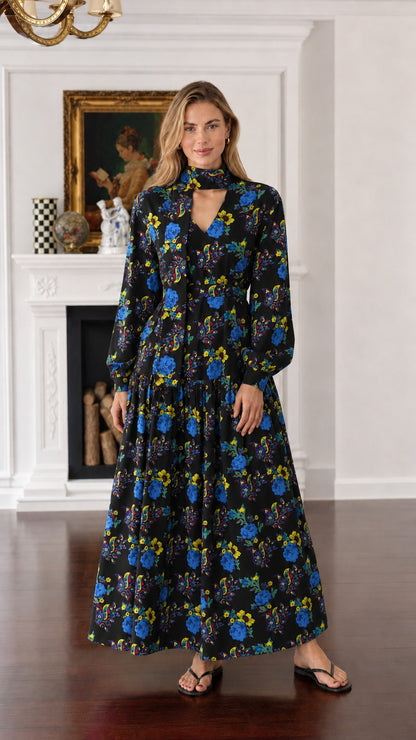 Front view of woman wearing black floral long-sleeve maxi dress