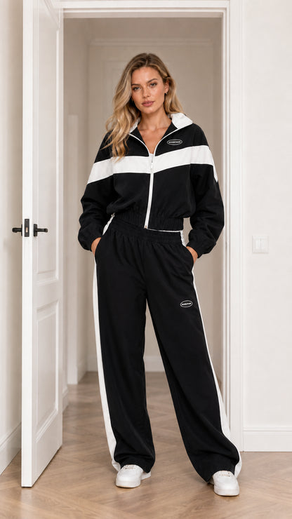 Model wearing Black colorblock zip-up tracksuit set with white accents