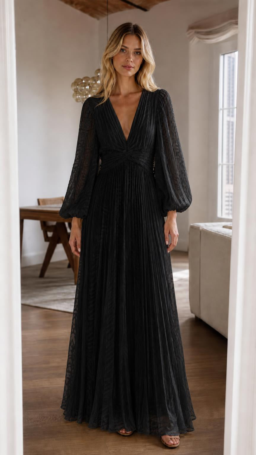 Front view of black pleated long sleeve maxi dress