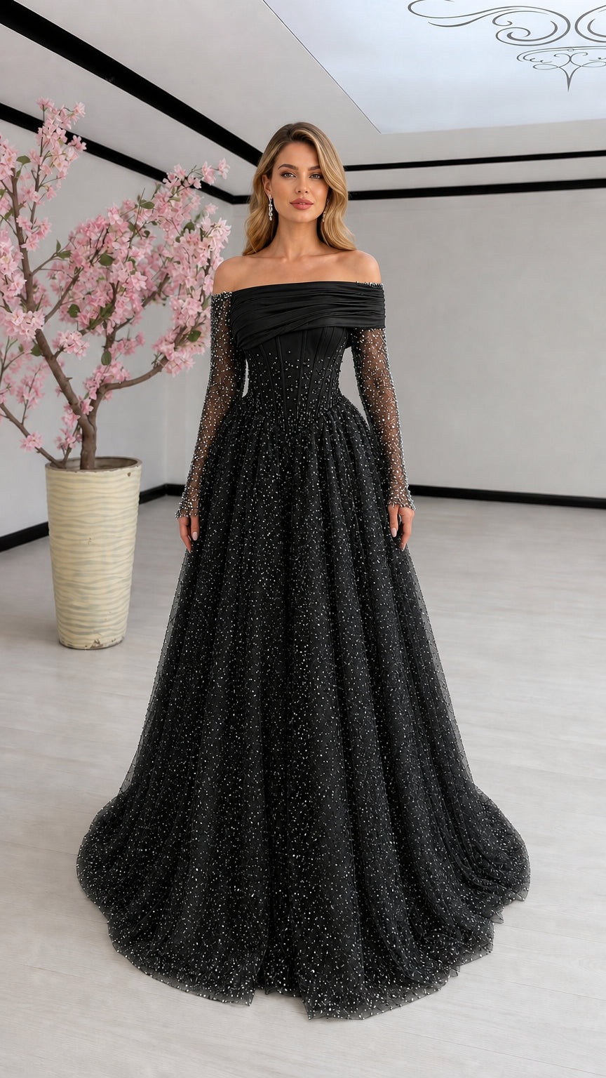 Black off-the-shoulder sparkling evening gown with sheer long sleeves