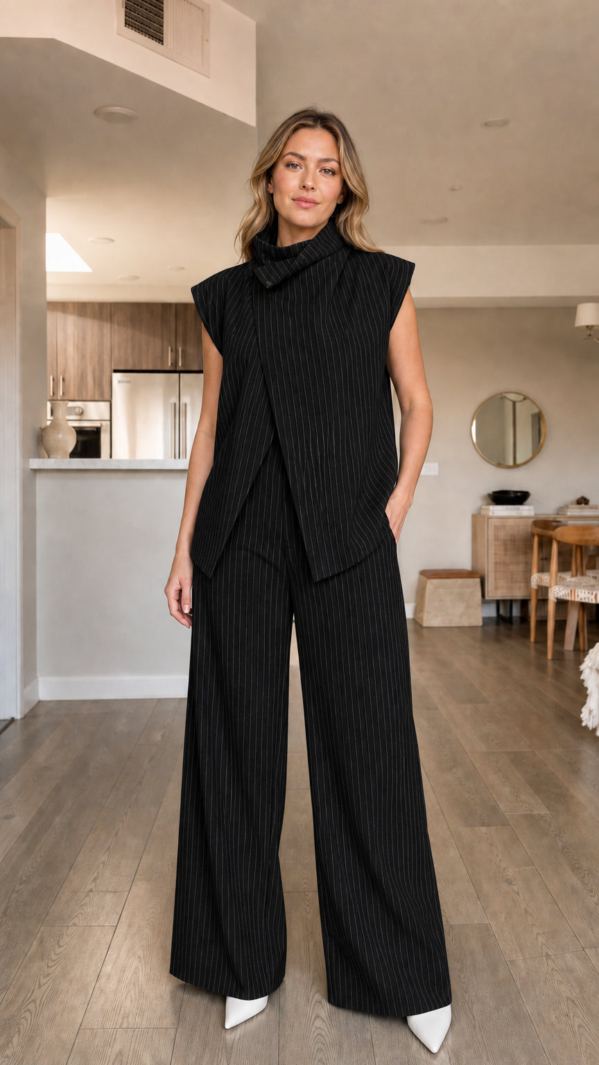 Model wearing black pinstripe matching set